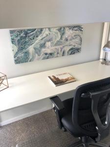 a desk in an office with a book on it at Winter Wonderland Retreat and Your Chicago Chill Getaway in Chicago