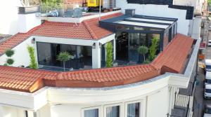 an aerial view of a white building with a red roof at Bellezza Hotel in Istanbul