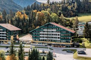an aerial view of a hotel with a parking lot at ALPINE Appartement 208 Schladming by globboard in Schladming