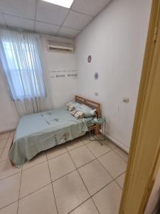 a hospital room with a bed and a window at Fellini 8 1/2 in Haifa