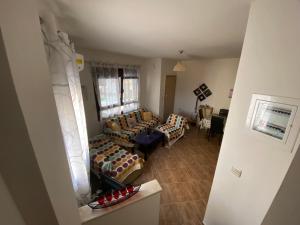 an aerial view of a living room with couches at Villa Armonia in Skala Potamias