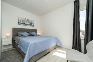 Ein Bett oder Betten in einem Zimmer der Unterkunft Villa Marita 2