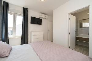 Ein Bett oder Betten in einem Zimmer der Unterkunft Villa Marita 2