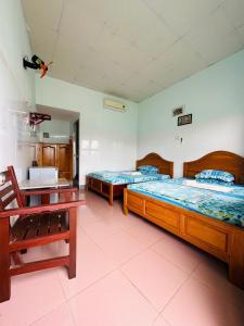 Un ou plusieurs lits dans un hébergement de l'établissement Song Hien Hotel
