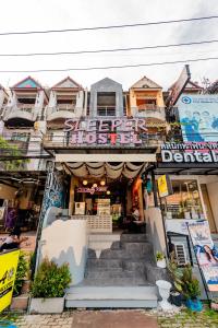 a building with stairs in front of it at Sleeper Hostel in Ao Nang Beach