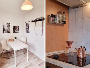 a kitchen with a white table and a counter top at STAYaWHILE Apartment COMFORT nähe Herzzentrum, Bali Therme, Kurpark GOP, free Parking, Netflix, Boxspringbett, neues Duschbad in Bad Oeynhausen