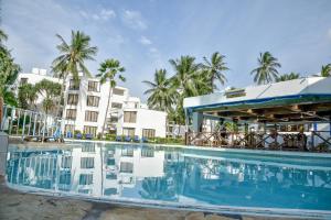 a pool at the resort at North Coast Beach Hotel in Kikambala