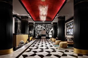 a lobby with a red ceiling and a checkered floor at Grand Bohemian Hotel Orlando, Autograph Collection in Orlando