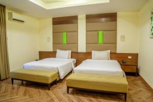 Postel nebo postele na pokoji v ubytování Hotel Alia Cikini