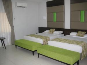 Postel nebo postele na pokoji v ubytování Hotel Alia Cikini