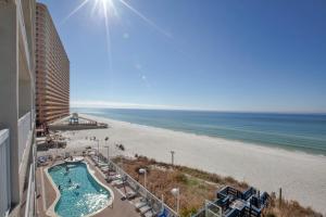 a view of the beach from the balcony of a resort at Seychelles Resort by Panhandle Getaways in Panama City Beach