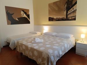 Downtown - Camere in Centro客房内的一张或多张床位