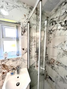 a bathroom with a sink and a shower at Ensuite Room Platinum 1 Harborne - Quinton Road in Birmingham