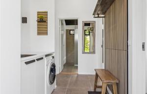 a laundry room with a washer and dryer at Cozy Home In Hjslev With Wifi in Højslev