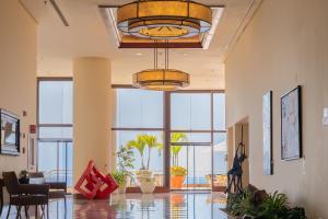 a lobby with a large room with large windows at Marriott Venezuela Hotel Playa Grande in Playa Grande