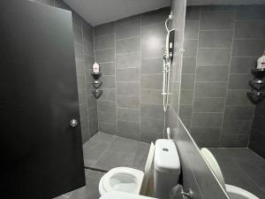 a bathroom with a shower and a toilet and a sink at Immense Studio EmpireDamansara/WiFi/Netflix in Petaling Jaya