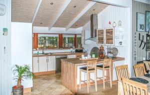 a kitchen with a wooden island in a room at Beautiful Home In Jerup With 4 Bedrooms, Sauna And Wifi in Jerup