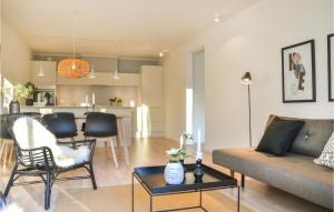 a living room with a couch and a table at Beautiful Apartment In Helsingr With Wifi in Helsingør