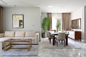 a living room with a couch and a table at VESTA - Cairo Festival City Residence in Cairo