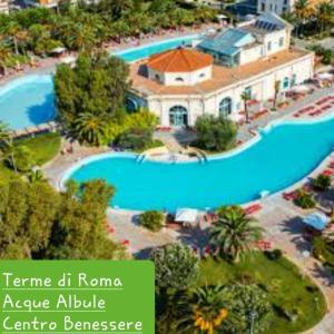 an aerial view of a large swimming pool in a resort at Coccinella house in Le Casette