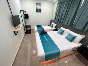 Postel nebo postele na pokoji v ubytování BEATRIX HOTEL