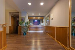 an empty hallway of a hospital with a bar at Hotel Kristina in Imperia