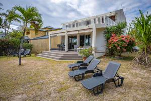 Zahrada ubytování Villa & Bungalow 'Coco des sables' les pieds dans l'eau