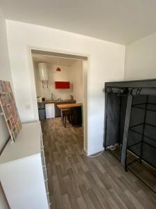 an empty room with a kitchen and a dining room at Studio hypercentre ralliement in Angers