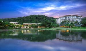 a large body of water in front of a building at Pico De Loro 2BR Carola B Unit with Lagoon View in Nasugbu
