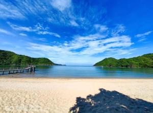 a view of a beach with a pier at Pico De Loro 2BR Carola B Unit with Lagoon View in Nasugbu