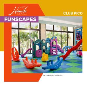 an image of a childrens playground with play equipment at Pico De Loro 2BR Carola B Unit with Lagoon View in Nasugbu