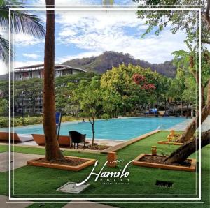 a picture of the pool at hamilton resort at Pico De Loro 2BR Carola B Unit with Lagoon View in Nasugbu
