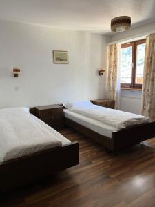 Voodi või voodid majutusasutuse Hotel Gemmi toas