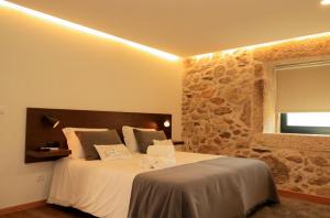 Postel nebo postele na pokoji v ubytování Casa Da Belina : casa de ferias com piscina, Labruja, Ponte de Lima