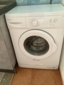 a white washer and dryer in a room at Capricornio Club Diffuso in Maiori