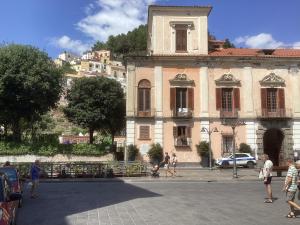 a group of people walking in front of a building at Capricornio Club Diffuso in Maiori