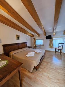 Postel nebo postele na pokoji v ubytování Park Hotel Sacro Cuore + 55 fotografií