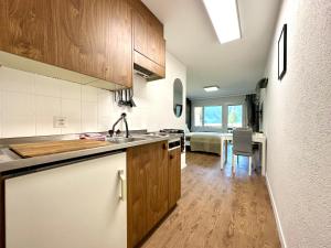 a kitchen with a sink and a counter top at Cozy place for 2 near Zermatt in Täsch