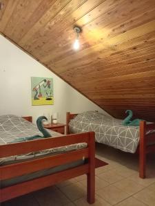 Postel nebo postele na pokoji v ubytování Ti'Kratèr Chambres d'hôtes