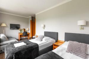 Postel nebo postele na pokoji v ubytování Hotel Helios 300m od Krupówek nowy BASEN od 12 lipca