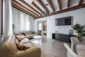 Televízia a/alebo spoločenská miestnosť v ubytovaní HAMMAM Venice