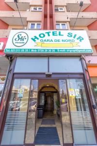 a sign over the entrance to a motel six car dealership at Hotel Sir Gara de Nord in Bucharest