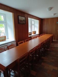 a large conference room with a long table and chairs at Zámeček nad Běleckým Mlýnem 