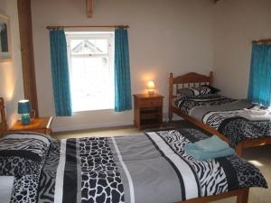 Postel nebo postele na pokoji v ubytování Lovely 7-Bed Apartment in Llandysul