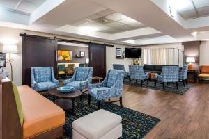 a waiting room with chairs and a couch and a table at Hampton Inn Winter Haven in Winter Haven
