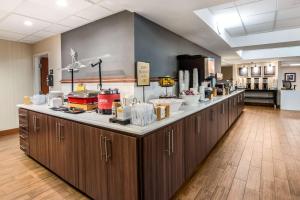 a kitchen with a counter with some food on it at Hampton Inn Winter Haven in Winter Haven