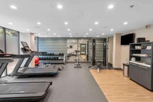 a gym with treadmills and elliptical machines at DoubleTree by Hilton South Charlotte Tyvola in Charlotte
