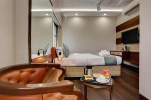 Postel nebo postele na pokoji v ubytování Hotel Ozone Inn Colaba