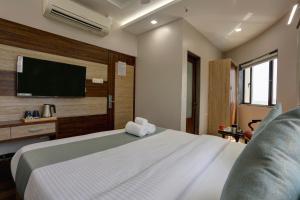 TV a/nebo společenská místnost v ubytování Hotel Ozone Inn Colaba