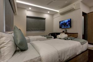 Postel nebo postele na pokoji v ubytování Hotel Ozone Inn Colaba